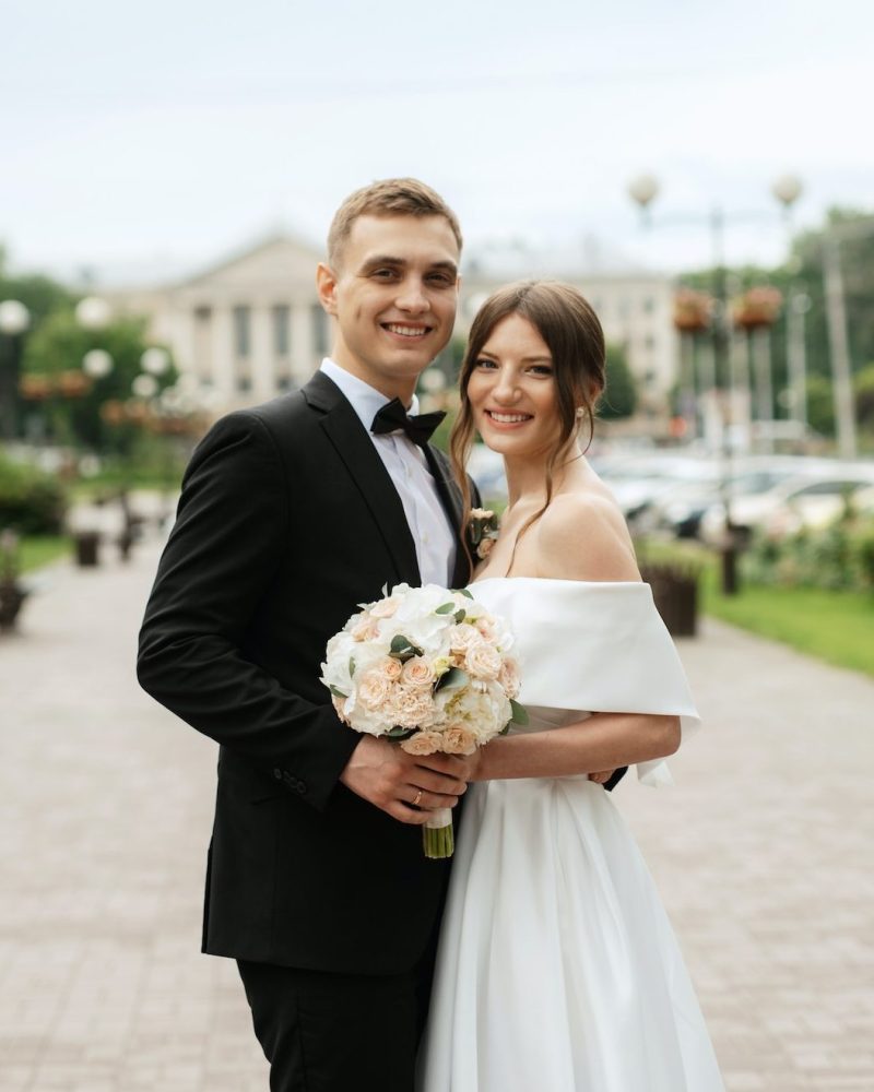 young-couple-bride-and-groom-in-a-white-short-dress-3-e1659371532669.jpg